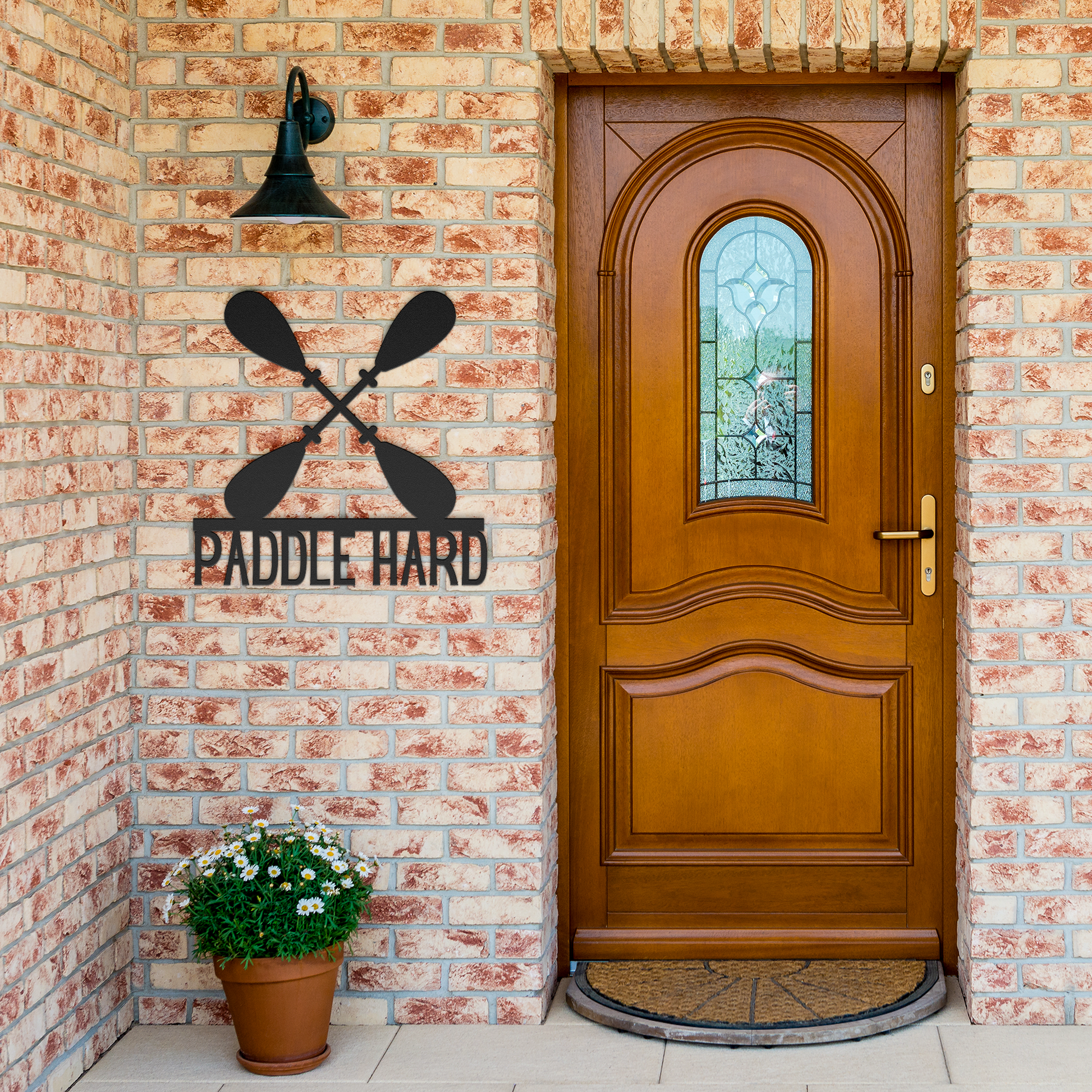 Paddle_Hard_Kayaking_Canoeing_Metal_Sign_Black_Brick_Entrance_Mockup.png