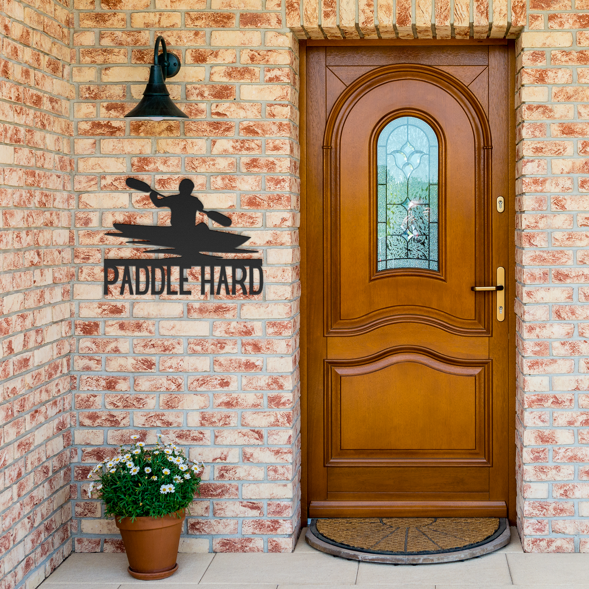 Paddle_Hard_Kayaking_Metal_Sign_Black_Brick_Entrance_Mockup.png